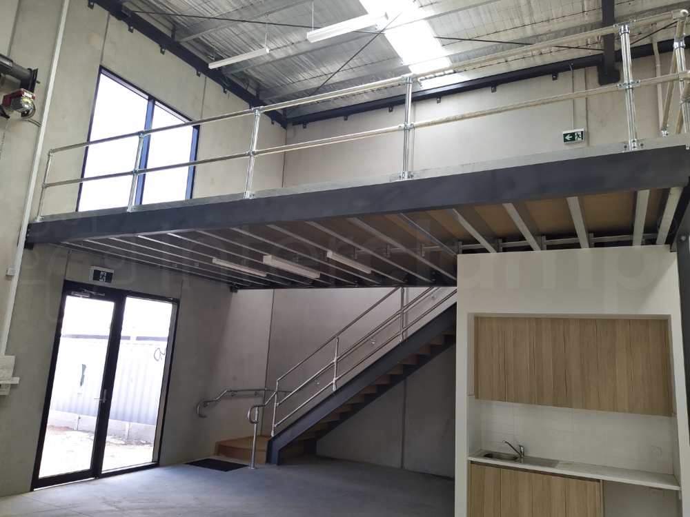 Interclamp modular key clamp guardrail and handrail installed on a mezzanine floor